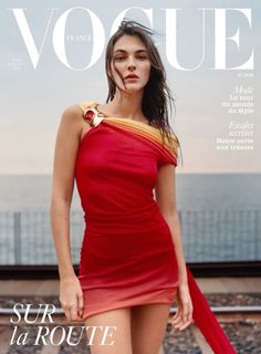 a woman in a red dress on the cover of a magazine