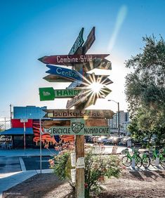 a wooden sign with many different signs on it