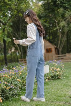 Classic denim overalls with floral embroidery around the bib, roomy side pockets, back pockets, button up sides and tapered legs. S: 32" waist, 40" hips, 12" rise, 23.5" thighs, 17" ankles, 23" inseamM: 33.5" waist, 41.5" hips, 12" rise, 24.5" thighs, 17.5" ankles, 23" inseamL: 35" waist, 43" hips, 12" rise, 25.5" thighs, 18" ankles, 23" inseam How to attach buckles:Slide the rectangular buckle on first, followed by the T-shaped buckle. Overall straps will hold on its own as such or you can slid Shoe Gifts, Embroidered Denim, Denim Overalls, Overall Dress, Retro Floral, Sweater Blouse, Cardigan Jacket, Fun Things, Medium Blue