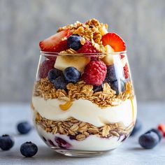 yogurt parfait with fruit and granola on top