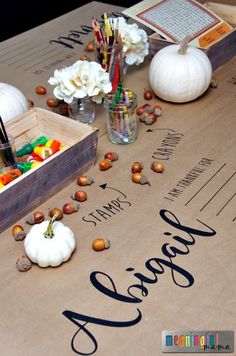 a table topped with lots of different types of candy and candies on top of a brown paper bag