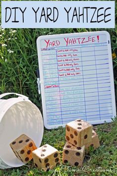 the yard yahtze board is next to some dices