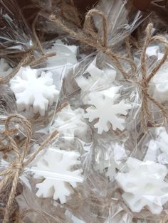 small snowflakes are wrapped in twine and rope