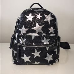 Black Backpack With Silver Stars!!! Get Them Before They Are Gone!!! (Also Have Black With Gold Stars) Trendy Silver Backpack For School, Silver Standard Backpack For School, Silver Standard School Backpack, Silver Backpack For Back To School, Casual Silver Backpack For School, Jansport Star Backpack, Silver School Backpack, School Glitter Backpack, Silver Standard Backpack For Daily Use