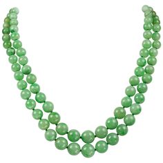 A double row jade necklace, both strands graduating from the centre measuring 5mm to 10mm, a total of one hundred beads, to a 14ct white gold jade carved clasp, length 31cm, stamped 14k, gross weight 73.6 grams. A chic jade necklace. This necklace features two strands of graduated jade beads in a lovely shade of green. For centuries, jade has held many associations with healing and protection. This necklace culminates in a yellow gold clasp which complements the beads wonderfully. This sophistic Period Art, Jade Bead Necklace, Necklace Art Deco, Deco Beads, Graduation Necklace, Necklace Art, Her Majesty The Queen, Art Deco Necklace, Jade Necklace