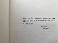 an open book with the words voltaire l'ingenu written in french