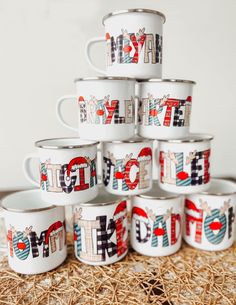 a stack of coffee mugs sitting on top of a table