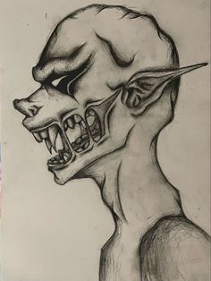 a drawing of a man's head with teeth and fangs on his face is shown