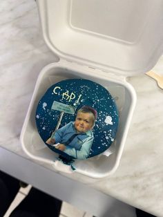 a small box with a picture of a baby in it