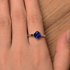 It is a lab sapphire ring. The main stone is 7 mm*7 mm cushion cut.weight about 1.94 carats. The basic metal is sterling silver and plated with rhodium. To change the metal to a solid gold (white/rose) or platinum is also available, please ask for a quotation if you want. You can also go to my shop Home for more elegant rings: https://www.etsy.com/shop/godjewelry?ref=hdr_shop_menu Sapphire is the September birthstone. More sapphire rings: https://www.etsy.com/shop/godjewelry?section_id=20715031 Sapphire Solitaire Jewelry In Cushion Cut, Sapphire Solitaire Jewelry With Cushion Cut, White Gold Sterling Silver Cushion Cut Sapphire Ring, White Gold Cushion Cut Sapphire Ring In Sterling Silver, Sapphire Cushion Cut Sterling Silver Ring, Cushion Cut Sapphire Ring Gift, Cushion Cut Sapphire Solitaire Jewelry, Cushion Cut White Gold Sapphire Ring In Sterling Silver, Cushion Cut Lab-created Sapphire Promise Ring