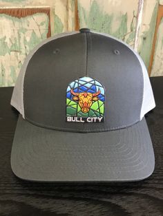 Bull City Stained Glass Patch Durham NC Trucker Hat AG Outfitters Exclusive Design, share our love of Durham, NC! Captuer brand hat, custom division of Richardson Caps Gray Trucker Cap, Gray Trucker Hat One Size, Adjustable Gray Trucker Hat With Flat Bill, Adjustable Gray Flat Bill Trucker Hat, Adjustable Charcoal Hat With Curved Brim, Gray Flat Brim Trucker Hat, Gray Snapback Trucker Hat, Gray Snapback Trucker Hat One Size, Gray One Size Fits Most Snapback Hat