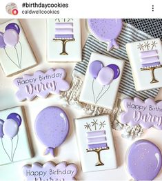 some cookies are decorated with purple icing and balloons