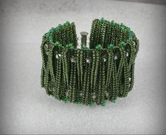 Beautiful bracelet from the Czech beads. Width: 4.5 cm For wrist size 18 cm (6.5 inches) More Women's bracelets are here: http://www.etsy.com/shop/Olisava?section_id=14122795 Green Beaded Bangle Crystal Bracelet, Green Beaded Crystal Bangle Bracelet, Green Beaded Bracelets With Large Beads For Party, Green Large Beaded Party Bracelets, Netted Bracelet, Seed Bead Bracelet, Seed Bead Bracelets, Czech Beads, Bead Weaving