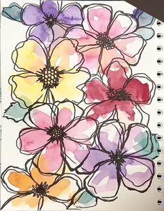 an art journal with watercolor flowers on it