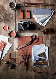 a wooden table topped with lots of different items