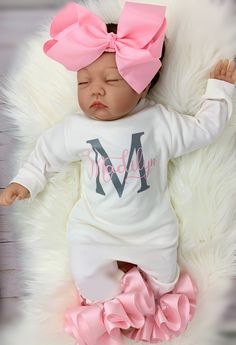 "100% COTTON This adorable customized outfit will have everyone in admiration of your little princess. This customized bodysuit is the perfect outfit for any occasion! Also offers an adorable large handmade ribbon bow! The bodysuit is accented with matching handmade ribbon anklets (which are removable for easy cleaning and style changes, how awesome). The anklets offer the perfect fluffy look for your little one, which we receive endless compliments on. The bodysuit is SUPER SOFT for the ultimat Personalized Pink Onesie For Birthday, Fitted Pink Onesie For Gift, Fitted Pink Onesie As A Gift, Fitted Pink Onesie Gift, Personalized Pink Onesie For First Birthday, Personalized Fitted Pink Onesie, Fitted Pink Onesie With Name Print, Pink Fitted Onesie As A Gift, Pink Fitted Onesie With Name Print