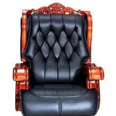 a black leather office chair with wood trimmings on the arms and back, in front of a white background