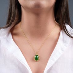 "💎 Handcrafted Jade Gemstone Necklace for Positive Energy and Wellness 💎 Embrace the beauty of Jade, a gemstone steeped in ancient history and revered for its remarkable spiritual properties. Known as the \"Stone of Serenity,\" Jade is believed to attract good luck, promote emotional healing, and inspire feelings of peace and harmony. 💎All stones are unique and may differ slightly from those shown in the pictures. No Necklace is the same, so the bracelet you order will be unique. ◖PRODUCT FEA Oval Jade Cabochon Necklaces, Oval Jade Cabochon Necklace, Jade Cabochon Oval Pendant Necklace, Green Oval Cabochon Gemstone Necklace, Elegant Jade Cabochon Necklace, Jade Amulet Pendant Jewelry, Jade Pendant Amulet Jewelry, Jade Cabochon Round Pendant Necklace, Round Jade Cabochon Pendant Necklace