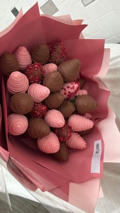 a bouquet of chocolates wrapped in pink paper