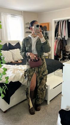 Jhene Aiko Casual Outfits, Shirt In Winter Outfit, Brown Clothes On Dark Skin, Chilly Day Outfit Black Women, Camo Maxi Skirt Outfit, Jackie Hill Perry Outfits, California November Outfits, Faux Leather Maxi Skirt Outfit, Long Camo Skirt Outfit