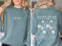 "ABIDE Sweatshirt - Christian Sweater 📖 Inspired by John 15:5 This Christian sweatshirt is adorned with the powerful message from John 15:5, reminding you to Abide in Christ. 🌟 Front Design: \"ABIDE\" a timeless message to live for Christ. 🌟 Back Design: Features the Bible verse from John 15:5 - \"Abide in me and I and you. I am the vine; you are the branches. If you remain in me and I in you, you will bear much fruit; apart from me you can do nothing. 👚Premium Sweatshirts: Designs are printed on Comfort Colors 1516 sweatshirts. Comfort Colors sweaters are premium quality sweaters and designed with Luxurious comfort in mind. Made with 80% ring-spun cotton and 20% polyester and the fabric is 3-end garment-dyed, ring-spun, color-blast fleece with a 100% cotton face. Christian Sweatshirt Remain In Me And I Will Remain In You, Christian Sweater, Abide In Me, Quality Sweaters, Christian Gift Shop, Christian Sweaters, Abide In Christ, John 15 5, Scripture Bible