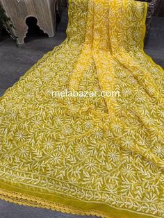 Beautiful and lightweight Chikankari hand embroidered geoDupatta with crochet lace. Luxury Bollywood Dupatta With Chikankari Embroidery, Luxury Chikankari Embroidery Shawl, Yellow Semi-stitched Chikankari Embroidered Fabric, Yellow Cotton Dupatta With Floral Embroidery, Bohemian Mulmul Dupatta With Floral Embroidery, Intricate Embroidery On Mulmul Fabric, Yellow Cotton Embroidered Fabric For Wedding, Multicolor Embroidered Chikankari Dupatta, Bohemian Mulmul Dupatta With Chikankari Embroidery