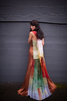 Mocha Khandro Dress Woven, handdyed silk organza and silk collaging form this indelible expanse of art to wear. -Silk satin sides -Ruched Silk charmeuse center back -Layered, silk collaged train -Geometric tone on tone embroidery -Woven silk organza center front panel Wai-Ching provides green, eco-friendly bridalwear, custom clothing, and kimonos in silk, hemp, and other natural fibers. We specialize in custom dresses, bridal gowns, bridesmaid dresses, and colorful wedding dresses. All the piece Multicolor Organza Floor-length Dress, Multicolor Organza Wedding Dress, Wedding Dress In Silk Chiffon With Bias Cut, Bohemian Silk Floor-length Gown, Multicolor Tissue Silk Dress For Wedding, Multicolor Tissue Silk Wedding Dress, Bohemian Silk Wedding Dress, Multicolor Organza Wedding Gown, Bohemian Silk Gown With Fitted Design