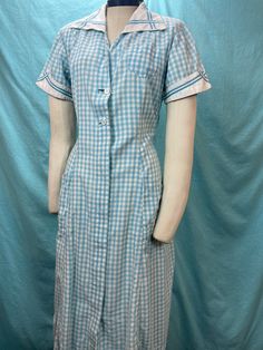 1940s W:35 Angelica Vintage Uniform Dress Pockets Gingham Plaid Blue Aqua Short Sleeve Button up Collared V Neck A-line Skirt Shirtwaist - Etsy Retro Short Sleeve Plaid Gingham Dress, Vintage Plaid Short Sleeve Dress, Short Sleeve Plaid Gingham Dress For Daywear, Short Sleeve Gingham Plaid Dress For Daywear, Vintage Style Gingham Plaid Short Sleeve Dress, Vintage Gingham Plaid Dress With Short Sleeves, Vintage Short Sleeve Plaid Cotton Dress, Retro Short Sleeve Plaid Dress, Casual Plaid Short Sleeve Dress With Buttons