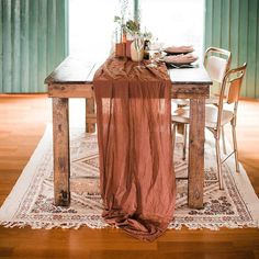 the table is set with an elegant linen runner