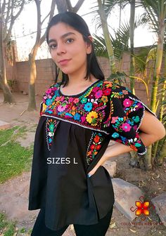 Mexican blouse that Shines you, Fashion as unique as you are. Beautiful blouse made by hand in Chiapas, Mexico creating fashion and art. This is a beautiful blouse with colorful flowers and short sleeve. Very comfortable, Goes great with jeans, leggings, skirt, shorts... Each piece is unique and handmade with dedication and taking care of every detail achieving the best quality in our products, which is why it makes it beautiful and unique each of the embroidered flowers. You can buy the set of Black Floral Embroidered Tops For Festivals, Traditional Black Tops With Floral Print, Black Tops With Floral Embroidery For Festivals, Black Floral Print Festival Blouse, Black Floral Print Blouse For Festival, Black Embroidered Top For Summer Festival, Multicolor Embroidered Floral Print Short Sleeve Blouse, Traditional Short Sleeve Blouse With Floral Embroidery, Black Embroidered Short Sleeve Top For Spring