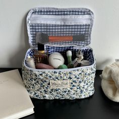 an open travel bag sitting on top of a table