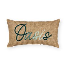 a pillow with the word oasis on it