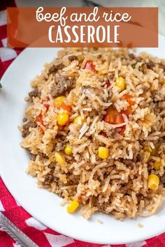 beef and rice casserole on a white plate with red checkered table cloth