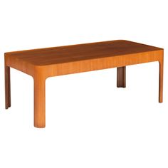 a wooden table sitting on top of a white floor