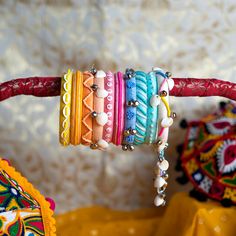 Handmade Bangle For Celebrations, Bohemian Handmade Beaded Bracelets For Celebration, Multicolor Bangle With Colorful Beads, Bohemian Beaded Bangle Bracelet For Wedding, Embroidered Bracelets For Wedding And Festivals, Adjustable Embroidered Festive Jewelry, Multicolor Embroidered Bangle Jewelry, Traditional Embroidered Bangle Jewelry, Bohemian Handmade Bangle For Celebration