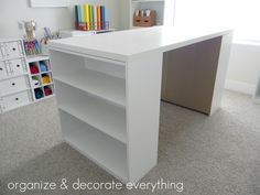 an image of a white desk with bookshelves