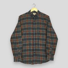 Vintage LL Bean Checkered Flannel Shirt Medium Y2K Ll Bean Usa Plaid Checked Flannel Shirt LL Bean Outdoor Rustic Buttondown Oxfords Size M Good Used Condition. No Stains and No Holes  Size (On Tag) : Size M **To make sure if it FITS YOU, refer at the exact measurements. Size Measurement (All measurements were taken lying flat) : Width [armpit to armpit] : 22 inches / 56 cm Length [shoulder to end of garment] : 29 inches / 74 cm THIS IS USED CLOTHING! PLEASE DON`T EXPECTED IT TO BE LIKE NEW OR D Plaid Long Sleeve Flannel Shirt With Button Closure, Plaid Button-up Tops, Winter Shirt With Buttons And Relaxed Fit, Winter Cotton Shirt With Button Closure, Winter Relaxed Fit Shirt With Buttons, Winter Relaxed Fit Shirt, Long Sleeve Yarn-dyed Cotton Tops, Yarn-dyed Long Sleeve Cotton Tops, Plaid Shirt With Buttons, Relaxed Fit