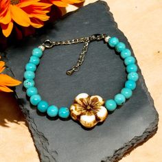 Charming Turquoise Beaded Bracelet accented with Saguaro blossom.  All of our jewelry is lead and nickel free.  Handmade Jewelry that Embodies the Rugged Spirit of the Wild West.  All listings in my shop are my original handmade designs therefore not any two pieces are exactly alike. I carefully craft each in my studio here in Tennessee.  Thank you for visiting and have a wonderful day! Bohemian Flower Bracelets Nickel Free, Nickel-free Bohemian Flower Bracelets, Turquoise Beaded Flower Bracelets, Turquoise Beaded Flower Bracelet, Adjustable Turquoise Flower Beaded Bracelet, Saguaro Blossom, Beaded Bracelet Flower, Simple Bead Earrings, Flower Charm Bracelet