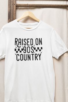 Raised on 90s country shirt Retro T-shirt For Summer Country Concerts, Graphic Tee For Spring Country Concerts, Trendy Tops For Country Concerts In Spring, Trendy Tops For Spring Country Concerts, Casual Spring Tops For Country Concerts, Country Style White Top With Graphic Print, 90s Style Streetwear Shirt For Spring, 90s Style Spring Shirt For Streetwear, 90s Style Spring Streetwear Shirt