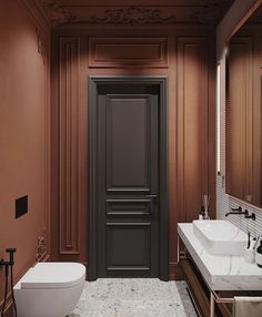 a bathroom with two sinks, a toilet and a large door in the middle of it