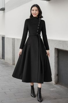 This black wool skirt is very designer and perfect for cold winter days, wrapped with a couple of button front closures in a wrapped style, with a belt attached at the waist, it is perfect for you. FEATURES 50% wool, 50% wool blend Fully liner with polyester Two pockets Stand up neckline Long sleeve coat Button closure in front Tie belt waist For Winter, Autumn Long wool coat Black wool coat dry clean ★★Mode size Height 170cm (5′ 7″)  Bust 84 cm (33")  Waist 66 cm (26")  She wears size XS. ★★Bes Black Long Wool Coat With Buttons, Black Wool Long Coat With Buttons, Black Wool Coat With Buttons, Black Wool Coat With Buttons For Winter, Black Winter Wool Coat With Buttons, Winter Wool Coat With Covered Buttons, Wool Coat Black, Black Wool Skirt, Wool Winter Coat