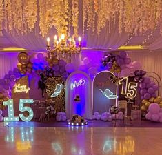 a decorated stage with balloons, lights and decorations for a wedding reception at the grand hyate