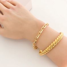 This stainless steel bracelet is a classic adornment crafted with exquisite artistry. Its subtly elegant twisted lines express sophistication and style, perfect for those who crave an exclusive and sophisticated look. Material: 18k gold / rhodium plated, triple plated, over stainless steel - water resistant/waterproof Size: Best fit for size 7" wrist, approx. 0.31" thick Closure: Side socket - pull apart to open Pull Apart, Jumpsuit Shorts Rompers, Match Making, Romper Pants, Candle Gift, Steel Bracelet, Steel Water, Jewelry Bags, Stainless Steel Bracelet