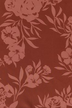 a red and white floral pattern on fabric