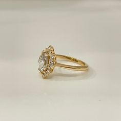 Pictured Style: VintageMetal: 14K Yellow GoldShape: MarquiseCenter Stone Size: 9x4.5 MM Center Stone Options:MoissaniteLab DiamondNatural Diamond Want to change this design or don't see what you want? We can customize most existing designs or custom make a ring from scratch. Please use our Custom Questionnaire and your personal jeweler will contact you. Oval Halo Yellow Gold Wedding Ring, Yellow Gold Marquise Halo Wedding Ring, Marquise Yellow Gold Halo Wedding Ring, From Scratch, Stone, Yellow, Ring, Design