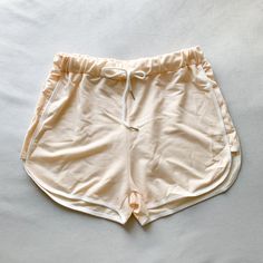 Ivory Cream Colored Retro Striped Dolphin Shorts Brand New, Never Worn No Label But Size Fits A Medium Unsure Of Brand White Stretch Pajama Shorts For Beach, Stretch White Pajama Shorts For Beach, White Stretch Shorts For Loungewear, White Sporty Pajama Shorts For Summer, Sporty White Pajama Shorts For Summer, White Stretch Pajama Shorts For Vacation, White Stretch Pajama Shorts For Summer, Stretch White Pajama Shorts For Summer, Cream Stretch Shorts For Summer