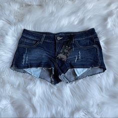 Brand New Extra Short Denim Shorts With A Cutoff Hem, Distressing, And Exposed Pockets. Approximate Measurements Laying Flat: Waist: 15 Inches Rise: 7 Inches Length: 8.5 Inches Leg Opening: 11 Inches Dark Wash Mid-rise Jean Shorts, Fitted Denim Blue Cutoff Jean Shorts, Trendy Dark Wash Mid-rise Jean Shorts, Trendy Mid-rise Dark Wash Jean Shorts, Fitted Ripped Dark Wash Shorts, Fitted Distressed Dark Wash Shorts, Fitted Denim Dark Wash Shorts, Fitted Denim Shorts In Dark Wash, Fitted Dark Wash Denim Shorts