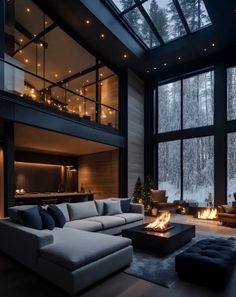 a living room filled with lots of furniture next to a fire place in front of a large window