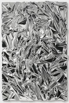 an abstract black and white photo with lots of silver foil