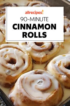 cinnamon rolls with white icing on top in a baking pan and text overlay reads,'90 - minute cinnamon rolls '